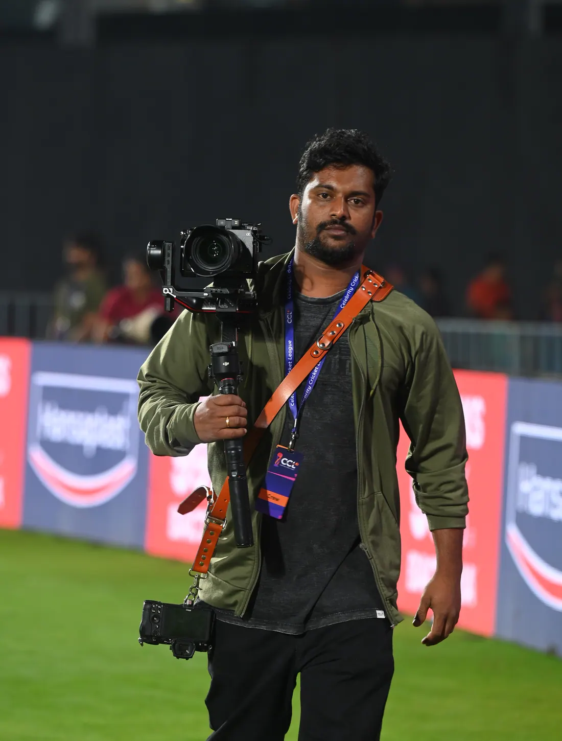 Ramesh holding a cinema camera during live event coverage