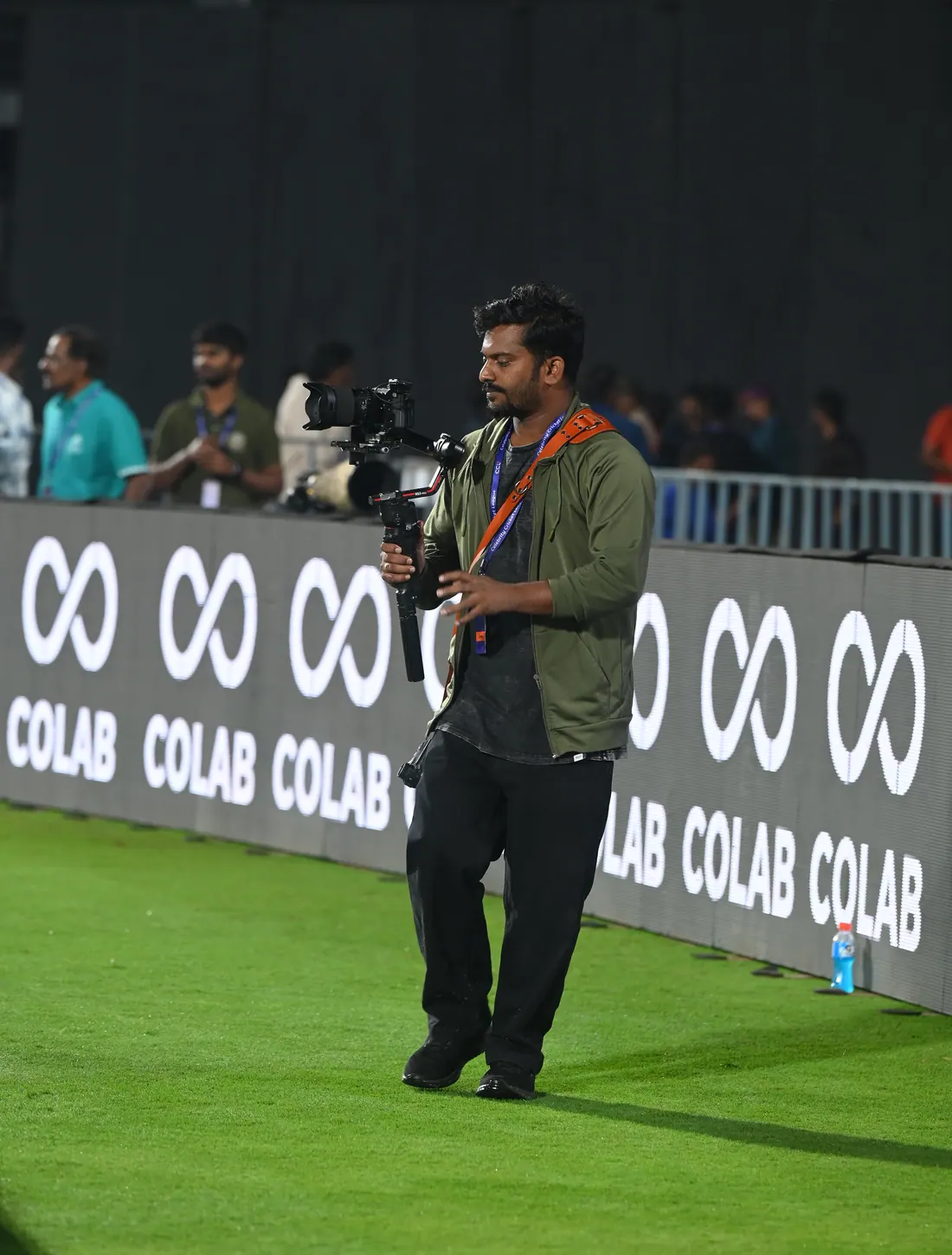 Ramesh working behind the camera with a gimbal during a live event