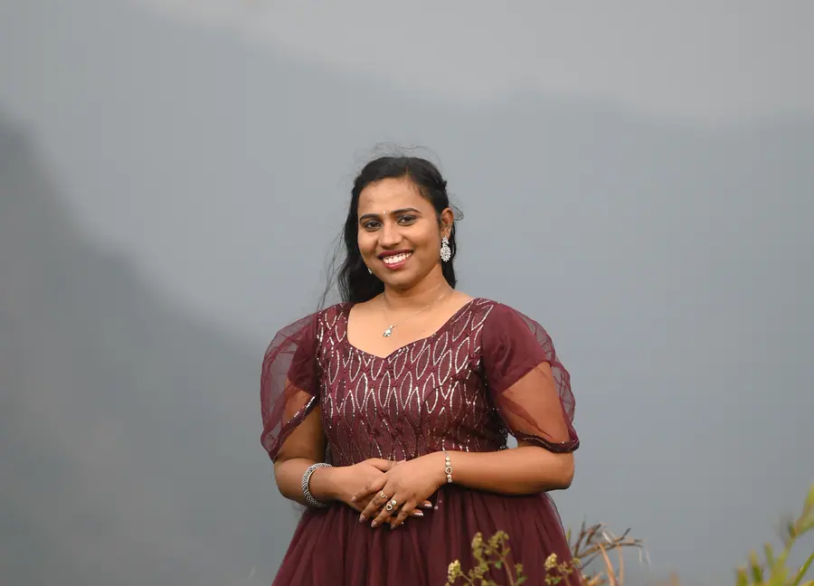 Couple portrait against a quiet hillside landscape