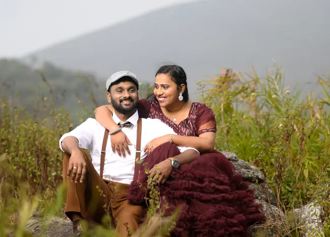 Pre-wedding couple walking together in natural outdoor light